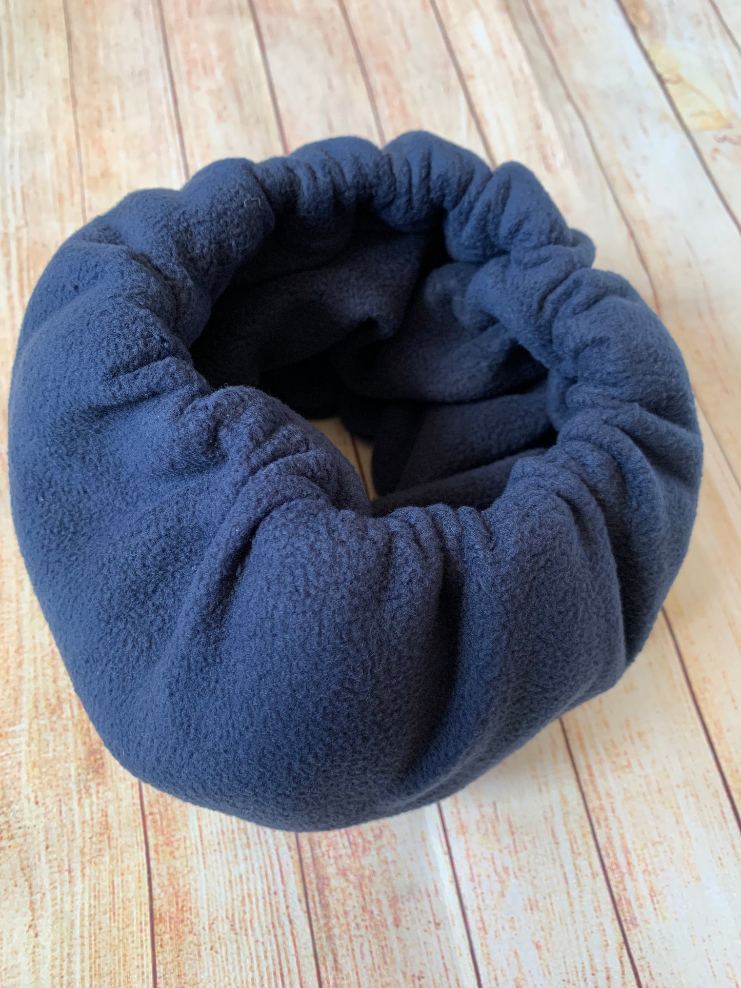Navy noise cancelling hush muff snood for dogs.