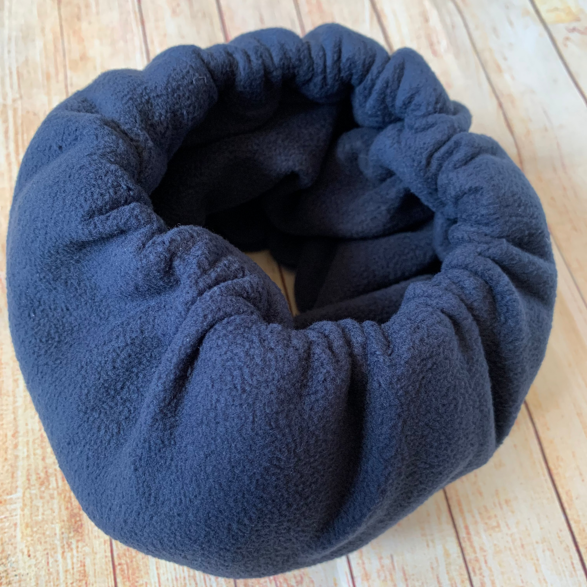 Navy noise cancelling hush muff snood for dogs.